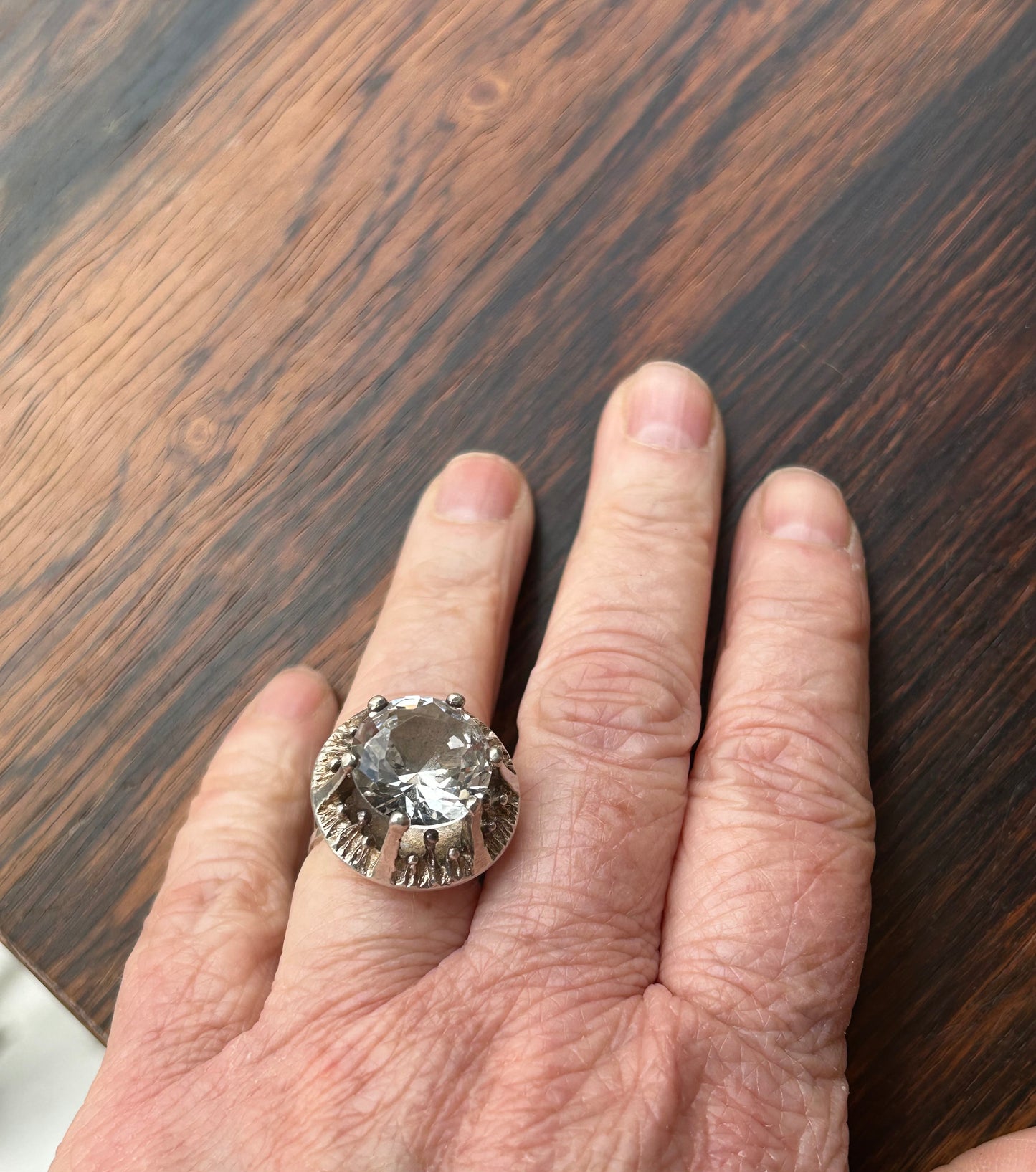 Silver ring with a large cut rock crystal